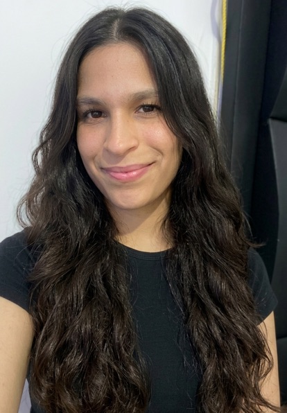 Woman with long hair looking into the camera