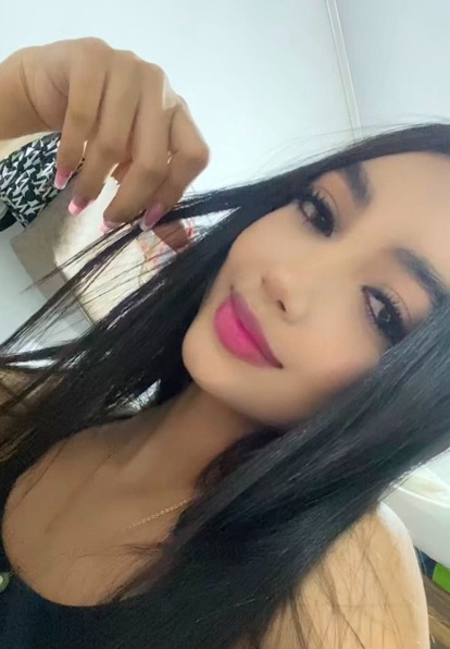 Woman looking into the camera at the start of a video chat