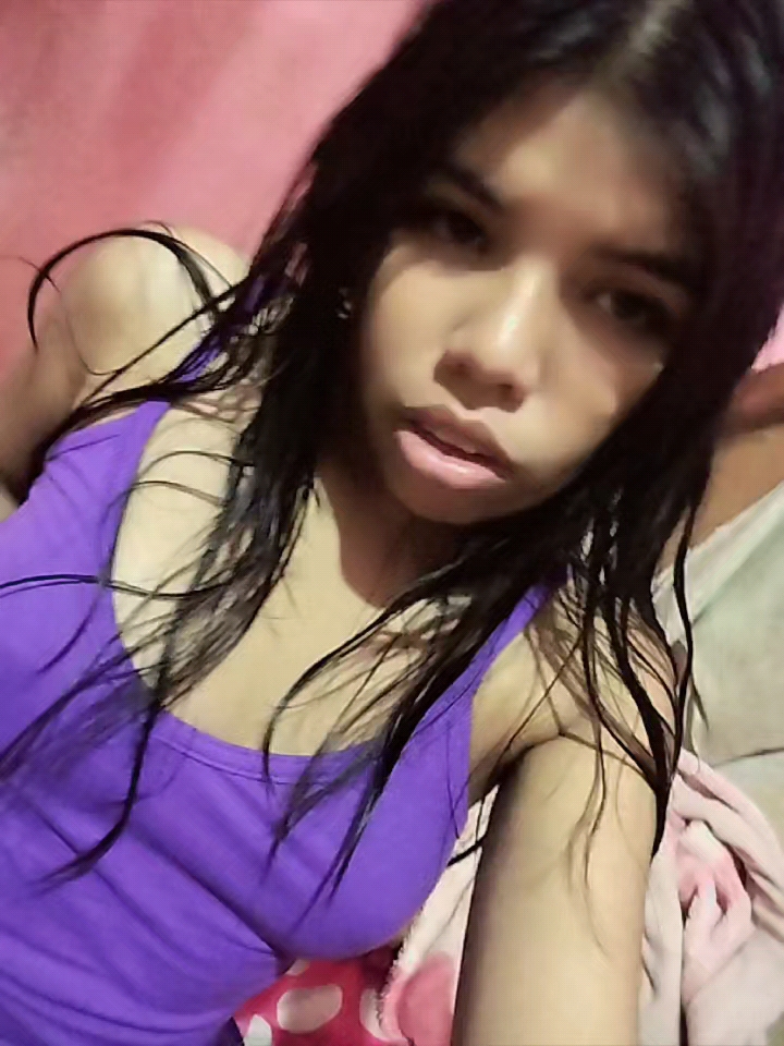Short clip of a woman at home looking towards the camera